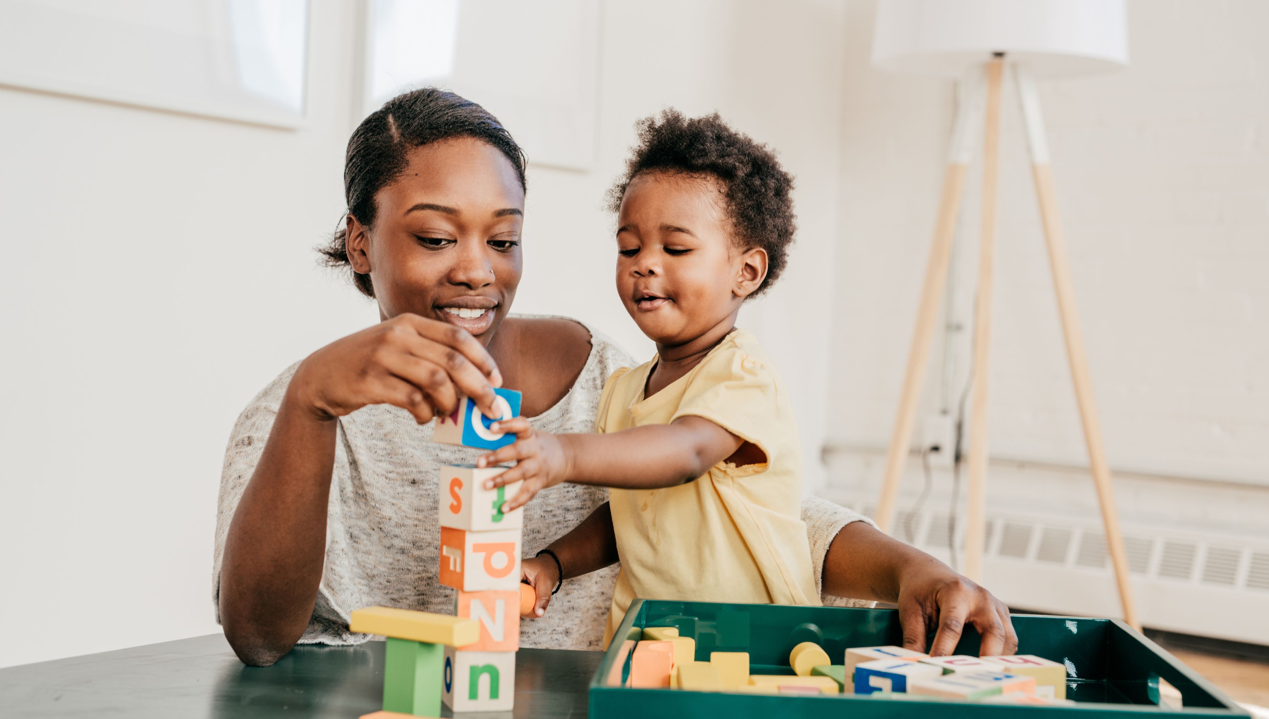 Mom and kid playing blocks 